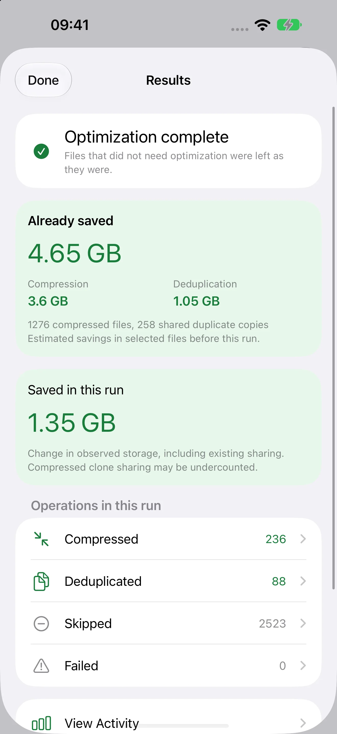 DiskPress for Files Results on iPhone showing optimization complete, previous savings, savings added by this run, and file counts.